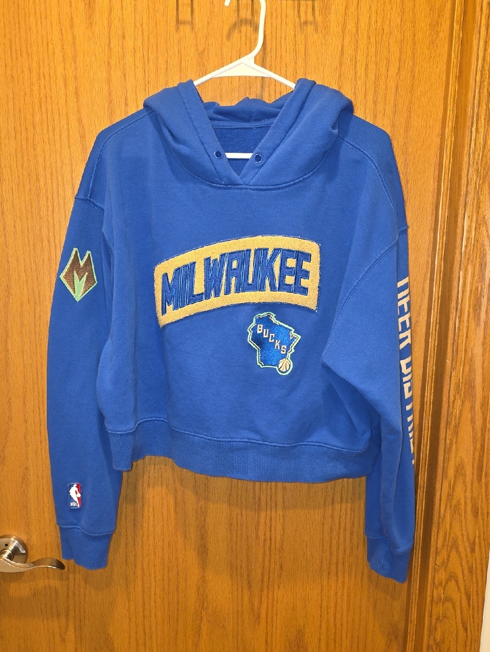 NBA Milwaukee Bucks Blue Cropped Hoodie with Gold Accent